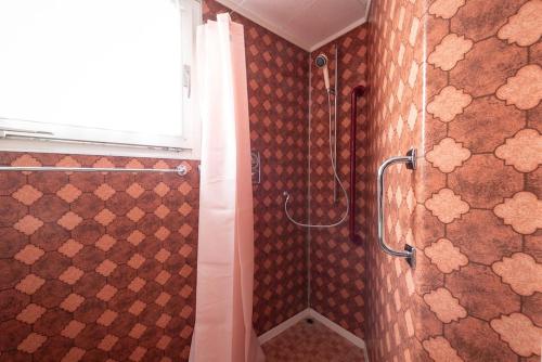 a bathroom with a shower with a shower curtain at 13 - Gästehaus Erika - Hundwil - Appenzellerland in Hundwil