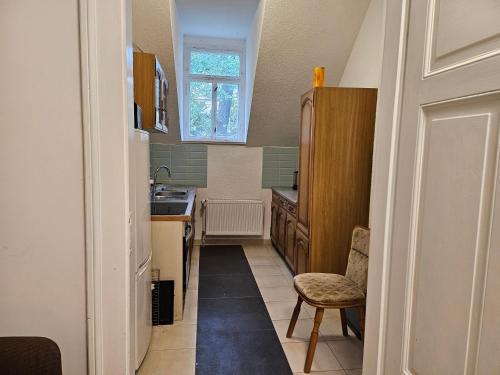 a small kitchen with a sink and a window at Villa Dietel Greiz in Greiz