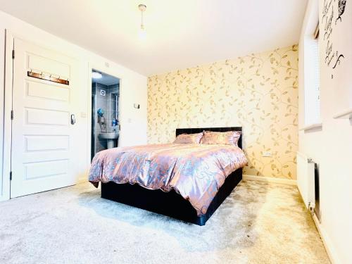 a bedroom with a bed and a bathroom at Best Places to Stay in Kent in Kent