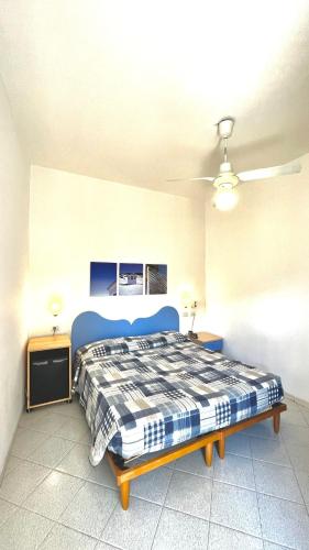a bedroom with a bed and a ceiling fan at Hotel Al Capo in Varigotti