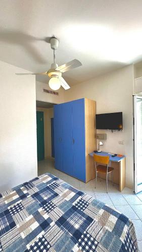 a bedroom with a bed and a ceiling fan at Hotel Al Capo in Varigotti