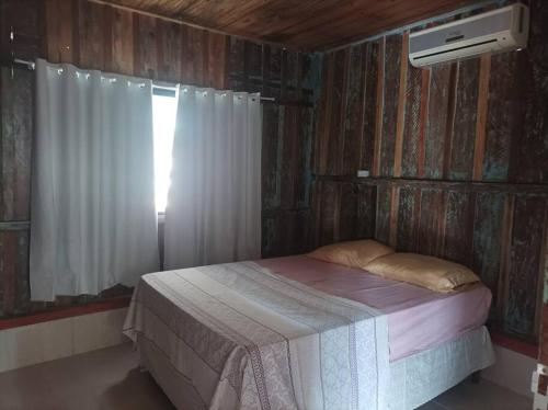 Ένα ή περισσότερα κρεβάτια σε δωμάτιο στο Casa aconchegante no centro