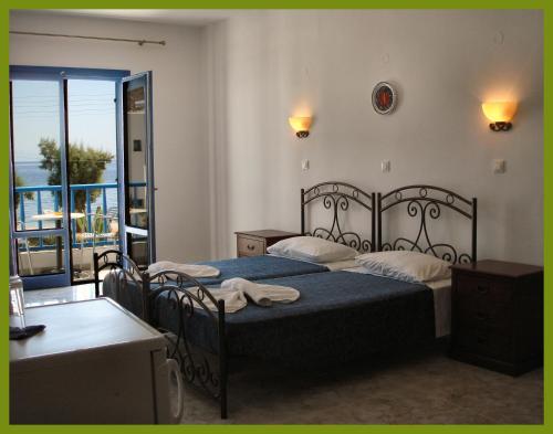 
Ένα ή περισσότερα κρεβάτια σε δωμάτιο στο Hotel Eleni Beach

