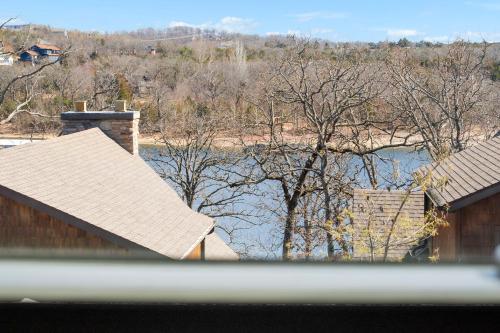 a view of a river with buildings and trees at Finns and Family in Branson