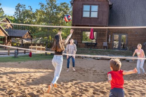 a group of people playing with a volley ball at Grin Inn Bear It in Branson