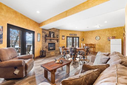 a living room with a couch and a table at Grin Inn Bear It in Branson