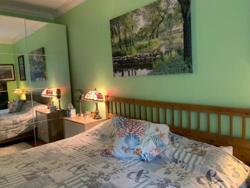 a bedroom with a bed and a mirror on the wall at 2 Bedrooms Condo in a excellent location in Surrey