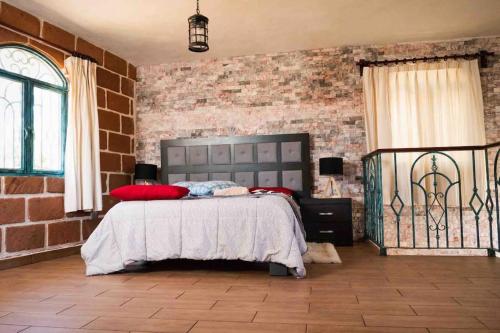 Katil atau katil-katil dalam bilik di Cabaña Amealco Encino