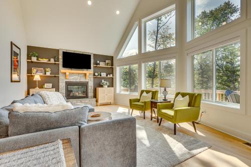 a living room with a couch and chairs and a tv at 6 Mi to Appalachian Trail Modern Front Royal Gem! in Paris