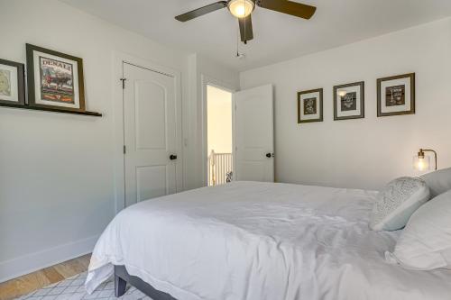 a bedroom with a white bed and a ceiling fan at 6 Mi to Appalachian Trail Modern Front Royal Gem! in Paris