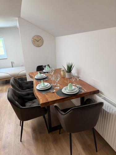 a dining room with a wooden table and chairs at Defereggerhof St Veit in Defereggen in Feld
