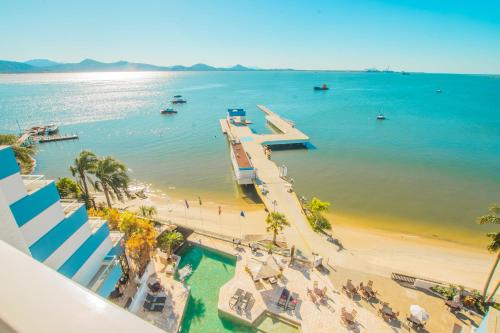 an aerial view of a beach with a pier at Hotel Villareal São Francisco do Sul in São Francisco do Sul