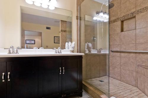 a bathroom with a sink and a shower at La Maison Hotel - Adults Only in Palm Springs