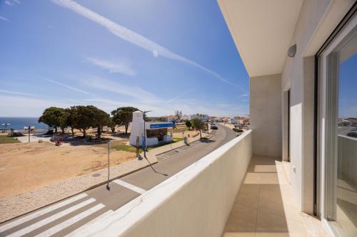 a balcony of a building with a view of the ocean at Pontalaia Ocean View in Sagres