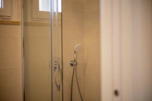 a shower with a glass door in a bathroom at Pontalaia Ocean View in Sagres