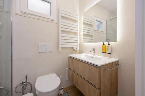 a bathroom with a sink and a toilet at Pontalaia Ocean View in Sagres