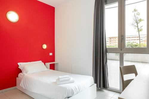 Posteľ alebo postele v izbe v ubytovaní Hotel Campus Sanpaolo
