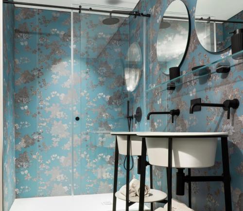 a bathroom with a sink and a shower at Luxury Loft near Duomo and Garage in Milan