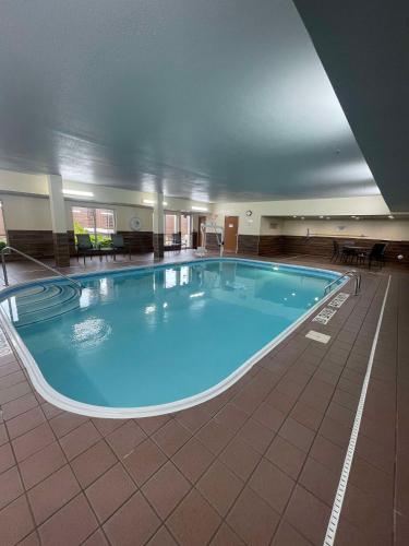a large swimming pool in a large building at Fairfield Inn & Suites Minneapolis St. Paul/Roseville in Roseville