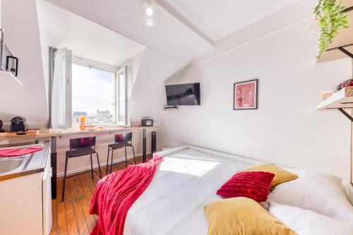 Ένα ή περισσότερα κρεβάτια σε δωμάτιο στο Le Burgundy - Cosyloc Agency - Centre historique