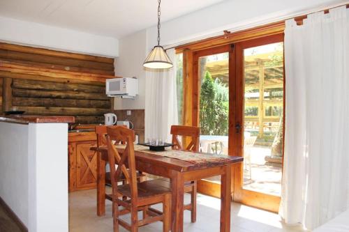 Kuchyň nebo kuchyňský kout v ubytování Mar Azul Suites Apart Boutique