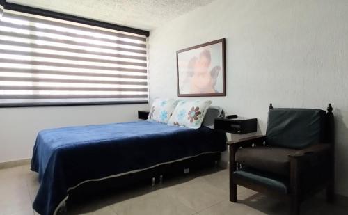 Postel nebo postele na pokoji v ubytování Habitación cerca Parque Simón Bolívar Aeropuerto Movistar Arena