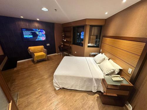 Postel nebo postele na pokoji v ubytování Lindo Flat em Moema no Hotel Wyndham Ibirapuera