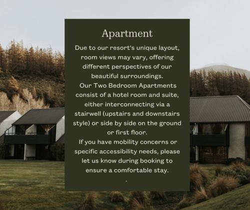 a sign in front of a house at Edgewater Hotel in Wanaka