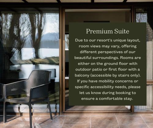 a sign in a window of a room with a chair at Edgewater Hotel in Wanaka