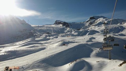 a ski lift on top of a snow covered mountain at Apartment Michael - Zell am See - Kaprun in Piesendorf
