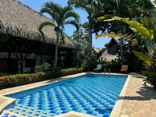 a swimming pool in front of a villa at Prima Luna Palomino in Palomino