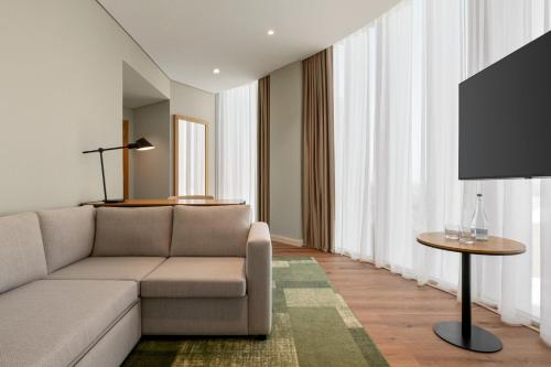 a living room with a couch and a table at Holiday Inn Beja by IHG in Beja