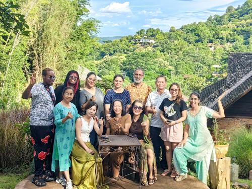 a group of people posing for a picture at Insda Wellness Resort in Chiang Mai
