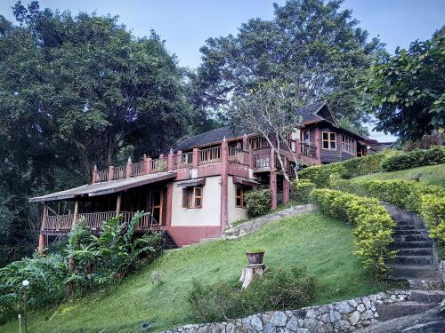 a large house on top of a hill at Insda Wellness Resort in Chiang Mai
