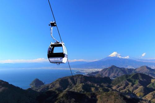 a cable car flying over the mountains at Izu Marriott Hotel Shuzenji in Izu