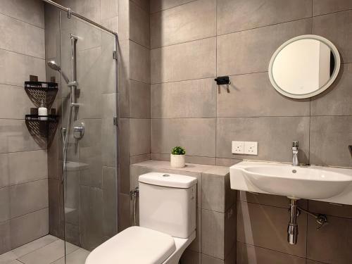 a bathroom with a toilet and a sink and a shower at K Avenue Modern Style Studio (5 Mins to Airport) in Kota Kinabalu