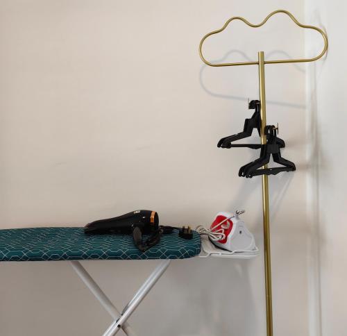 a table with a helmet on it next to a lamp at K Avenue Modern Style Studio (5 Mins to Airport) in Kota Kinabalu