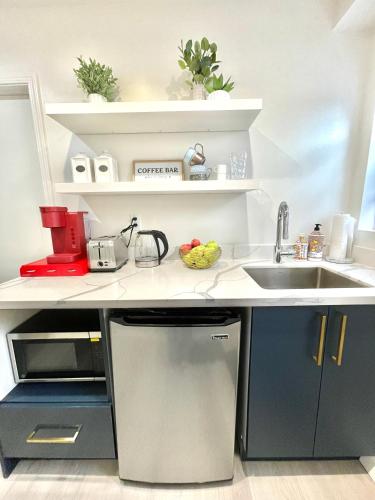a kitchen with a sink and a counter top at Private Lakeside Master Suite - Explore San Francisco's Urban Nature Galore in San Francisco