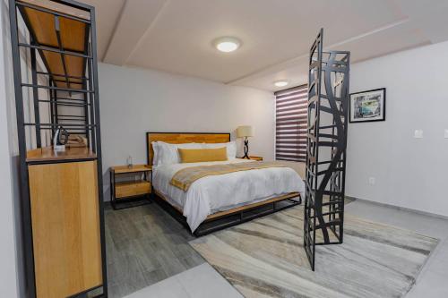 a bedroom with a bunk bed and a ladder at Lofts By Verticca in Santa Cruz Tecamac
