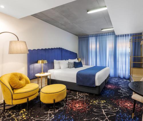 Oaks Melbourne St Kilda Road Hotelにあるベッド