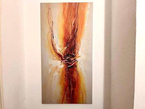 a painting of a flower on a wall at HillMark Suites in Ayer Keroh