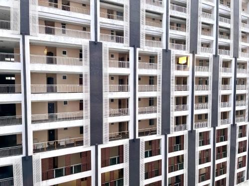 a tall apartment building with many balconies at HillMark Suites in Ayer Keroh
