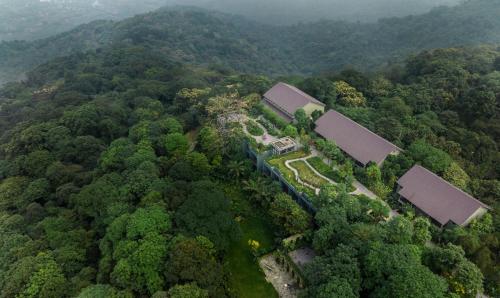 an aerial view of a house in the middle of a forest at Amour Resort Bavi in Hanoi