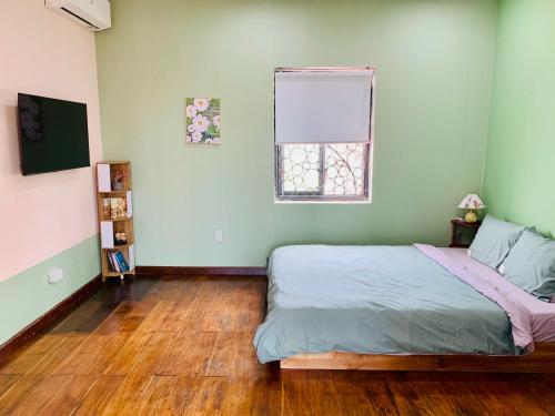 En eller flere senge i et værelse på The Light Corner Huế