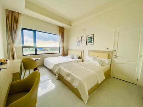 Postel nebo postele na pokoji v ubytování Island Sunset Hotel - Đảo Phú Quý