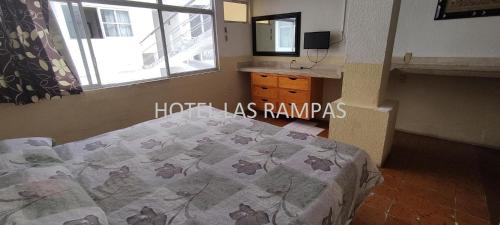 Katil atau katil-katil dalam bilik di Hotel Económico Las Rampas Acapulco