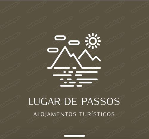 a logo with mountains and a sun and clouds at Lugar de Passos in Sesimbra