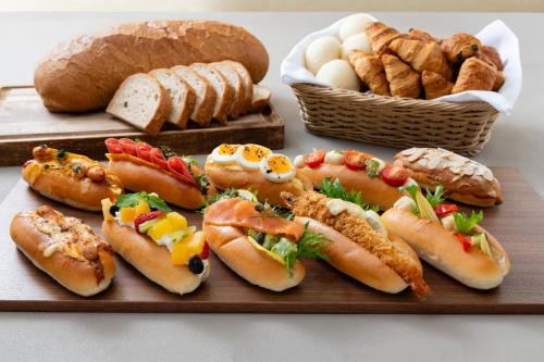 a plate of food with hot dogs and bread at Hotel Granvia Osaka-JR Hotel Group in Osaka