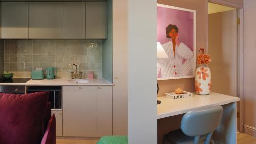a kitchen with a counter and a sink in a room at The Trade Boutique Hotel in Cape Town