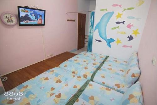 Cama o camas de una habitación en 綠島 梅蓮民宿 機車 潛水 浮潛